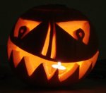 A pumpkin carved into a Jack-o'-lantern for Halloween.